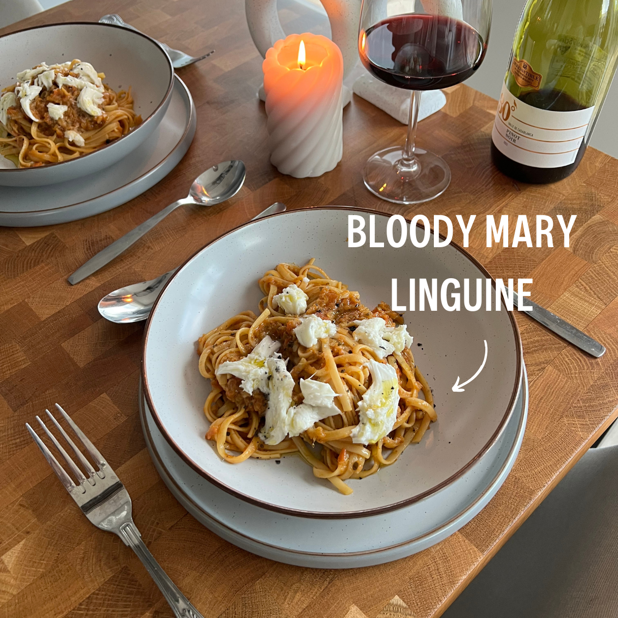 Blood Mary Linguine served on a plate for dinner with a date night dinner set up