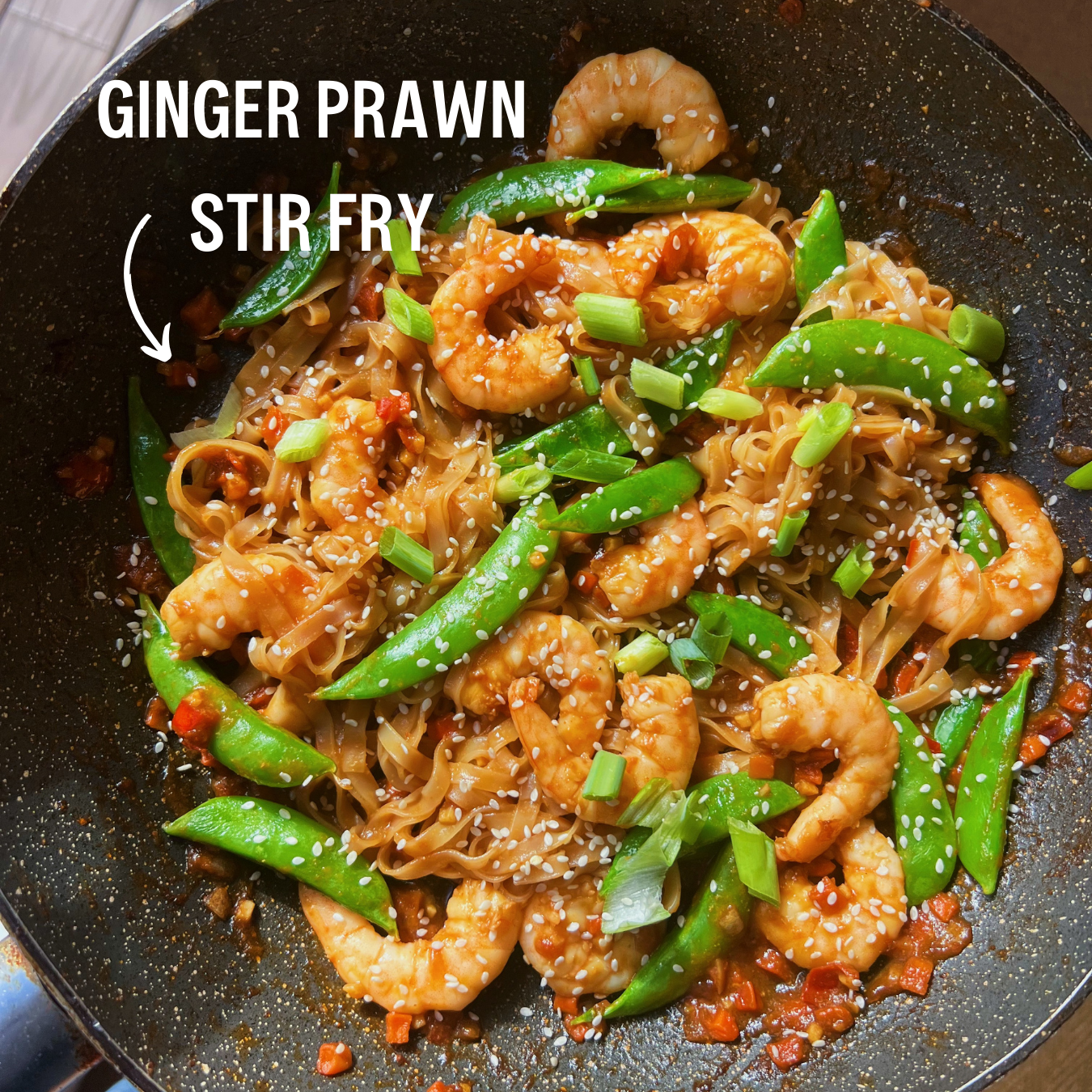 Prawn and ginger stir fry in a wok