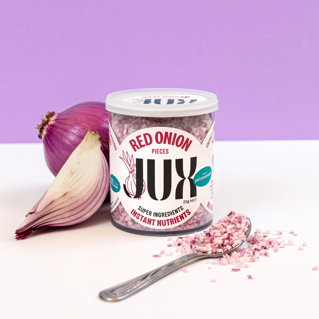 JUX chopped Freeze-dried Red Onion pieces in pot and on teaspoon next to fresh red onion