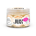 Jar of chopped ginger with 'JUX' branding on a white background