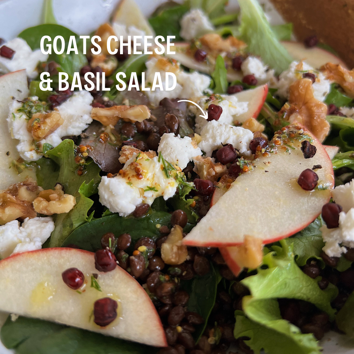 A goats cheese salad topped with JUX Freeze-dried Basil